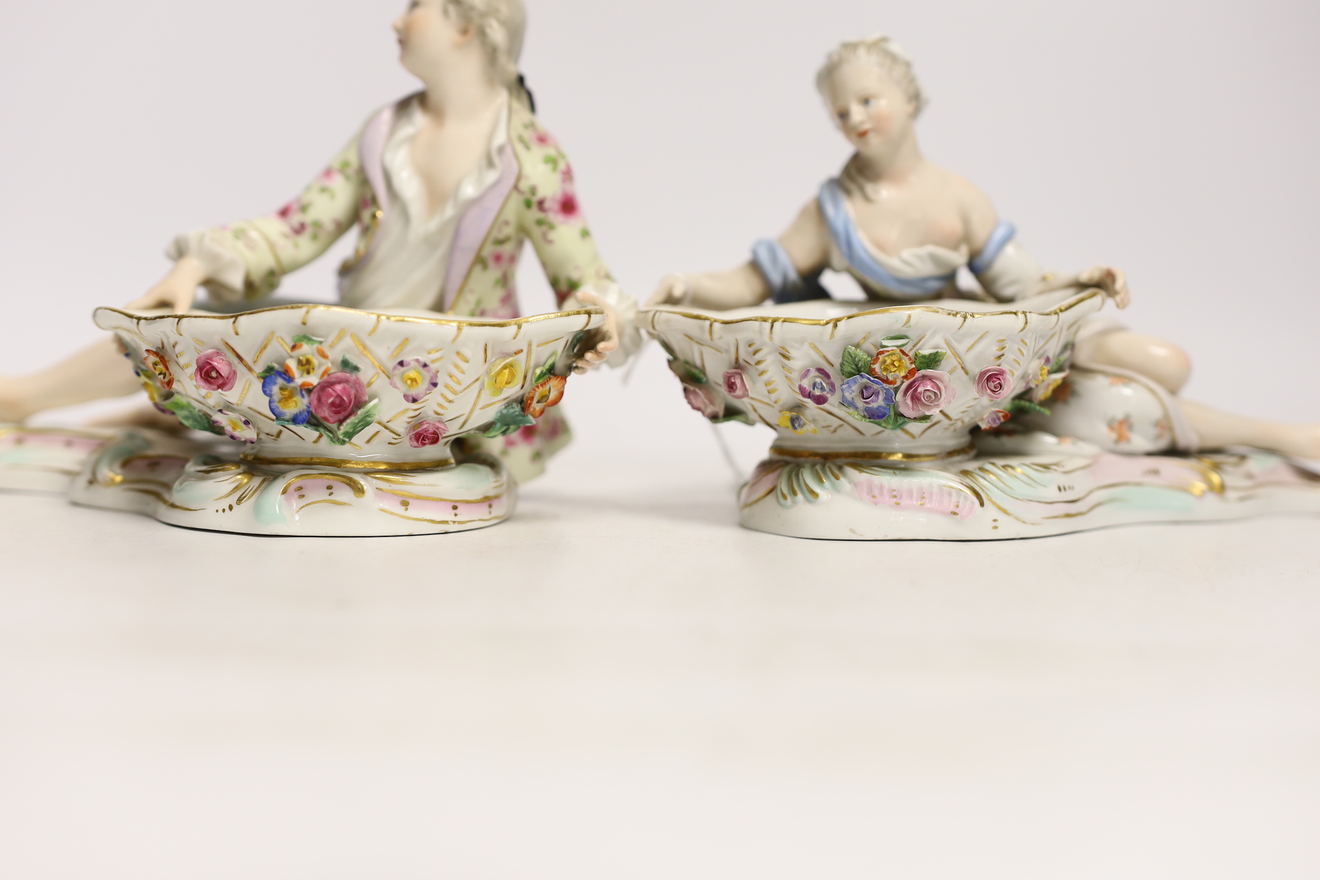 A pair of 19th century Meissen bon-bon figures, incised numbers 2875 and 2872